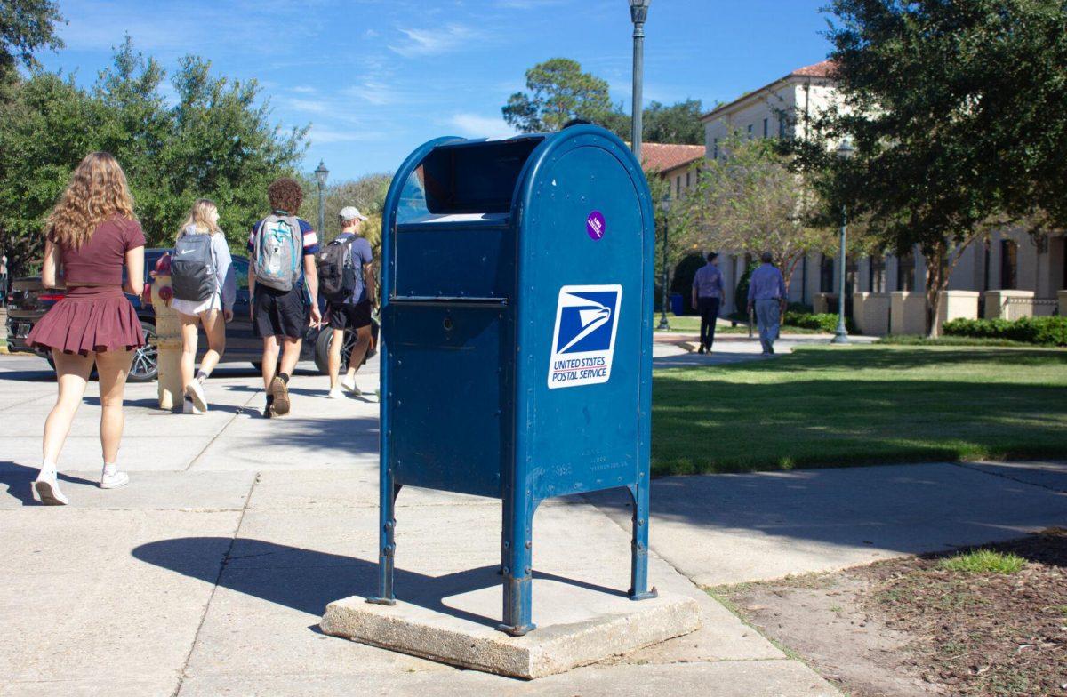 A blue postal box sits on Monday, Oct. 3, 2022, in front of Laville Hall in Baton Rouge, La.