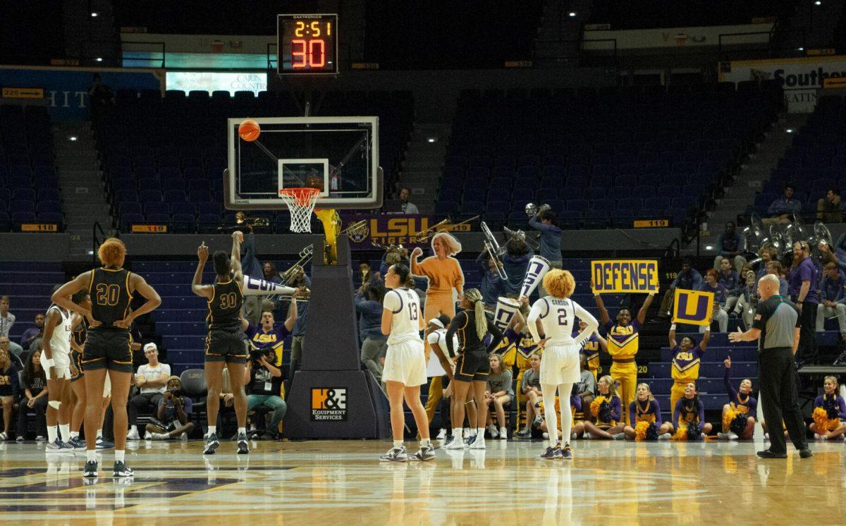 LSU cheerleaders and members of LSU's Bengal Brass band roar with the crowd to distract Mississippi College's center Danielle Tennant during her free throw at an exhibition game on Thursday, Oct. 27, 2022, in the Pete Maravich Assembly Center on N. Stadium Drive.