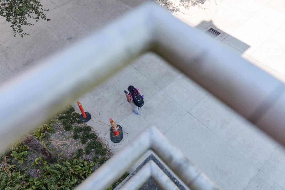 An LSU student walks on Friday, Oct. 7, 2022, past the LSU Art and Design building in Baton Rouge, La.