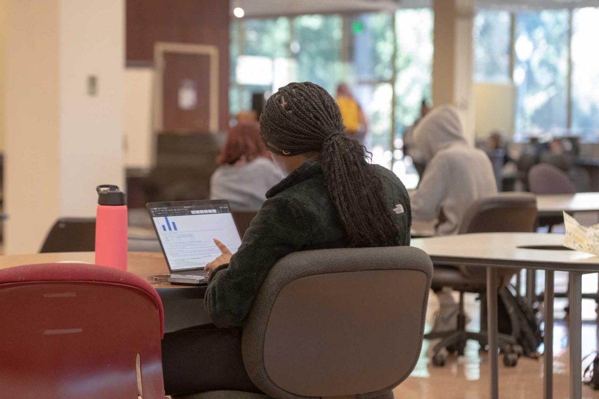 The LSU student works on schoolwork on Wednesday, Oct. 26, 2022, in the LSU Library in Baton Rouge, La.