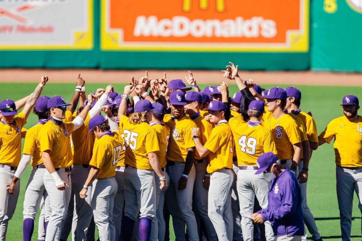 LSU baseball players hold up the number one with their hands Wednesday, Sep. 30, 2020 during LSU baseball's first fall practice in Alex Box Stadium on Gourrier Avenue.