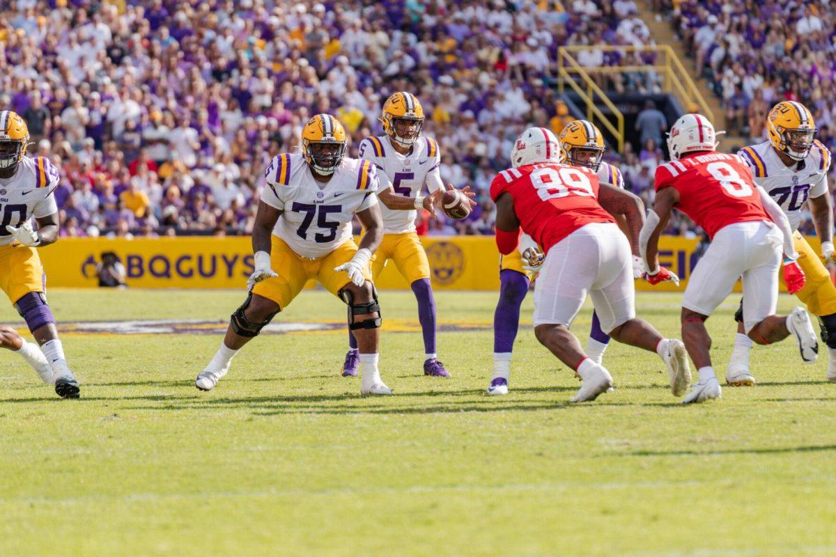 LSU football junior quarterback Jayden Daniels (5) takes the snap on Saturday, Oct. 22, 2022, during LSU&#8217;s 45-20 victory over Ole Miss in Tiger Stadium in Baton Rouge, La.