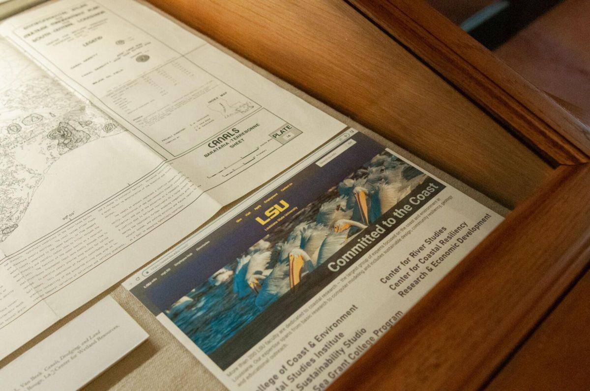 A screenshot of LSU's website is included in a dispaly case at the Water and Louisiana Consequences with Coastal Land exhibit hosted at Hill Memorial Library on Field House Drive in Baton Rouge, La on Tuesday, Oct. 11, 2022.