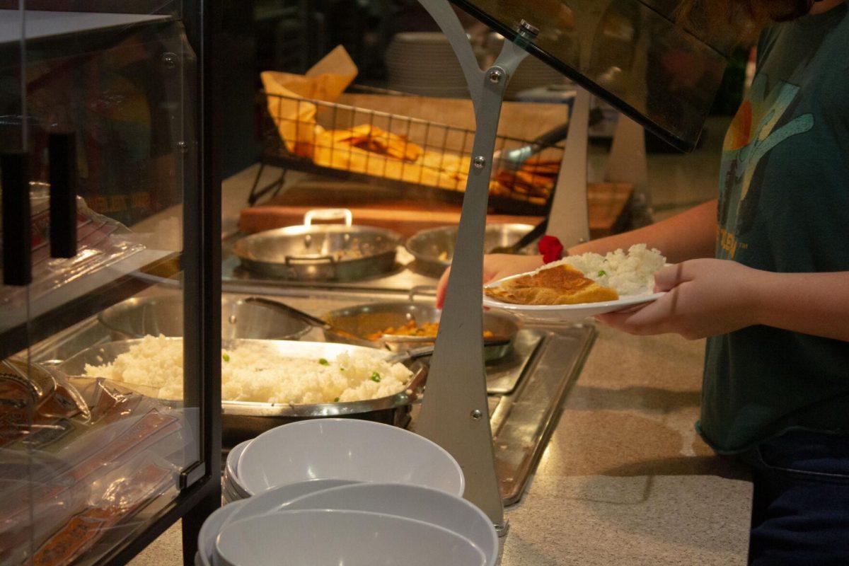 A student makes their plate from the vegetarian options on Monday, Oct. 3, 2022, in The 5 Dining Hall in Baton Rouge, La.