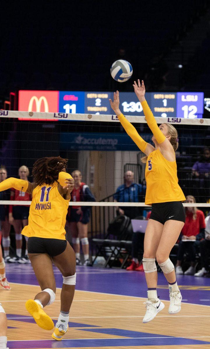 LSU volleyball graduate student Josie Vondran (5) sets the ball to senior Anita Anwusi (11) on Saturday, Oct. 1, 2022, during LSU&#8217;s 2-3 defeat to Ole Miss at the Pete Maravich Assembly Center in Baton Rouge, La.