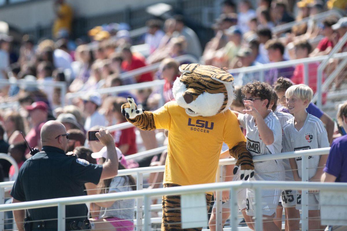 Mike the Tiger poses with young fans for a picture on Sunday, Oct. 9, 2022, during LSU&#8217;s defeat to Alabama 0-5 at LSU&#8217;s Soccer Stadium off Nicholson Drive.