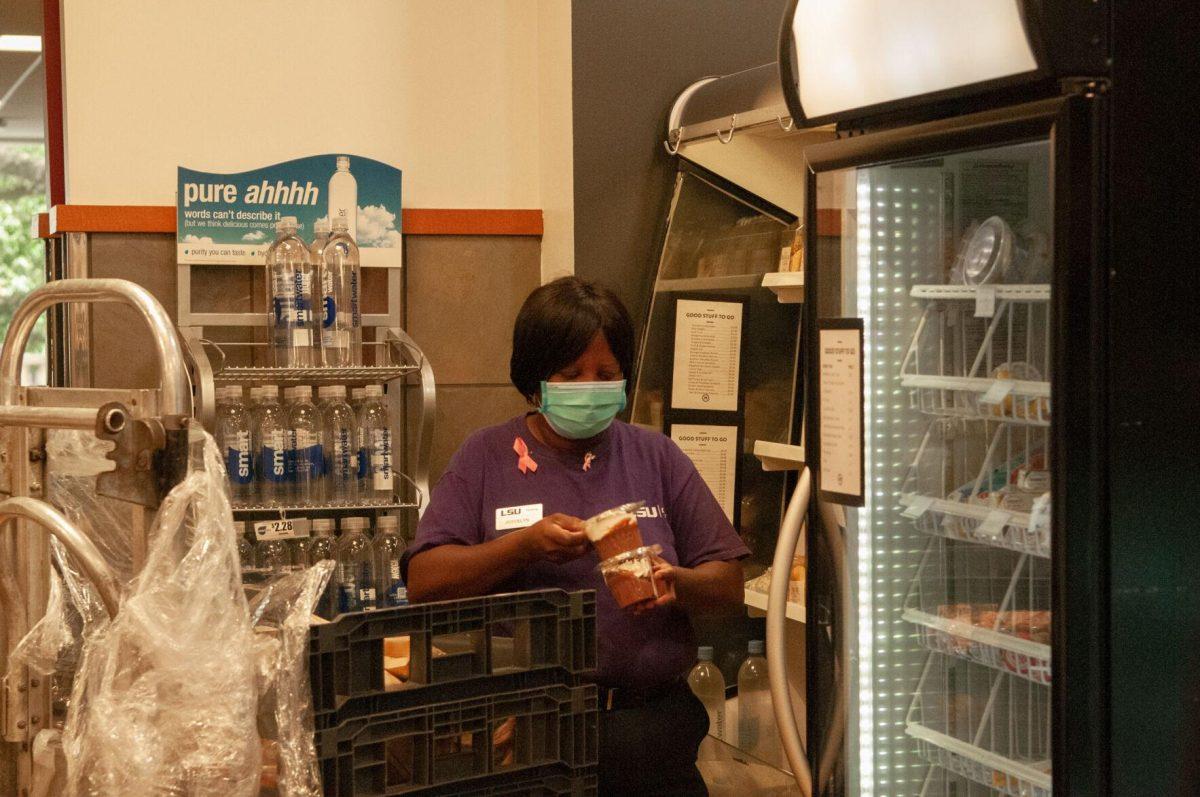 An employee at On-The-Geaux restocks items on Thursday, Oct. 6, 2022, in the LSU Student Union on Highland Road in Baton Rouge, La.