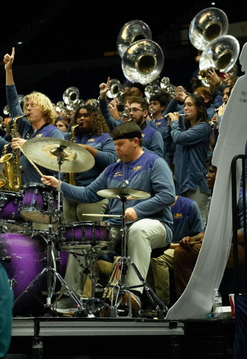 One of the drummer's for LSU's Bengal Brass band plays a beat for his peers to follow at an exhibition game against Mississippi College on Thursday, Oct. 27, 2022, in the Pete Maravich Assembly Center on N. Stadium Drive.