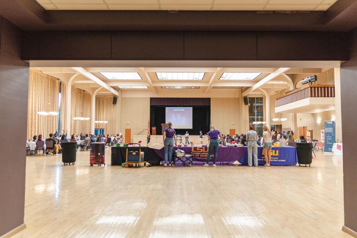 Table Nine cheers after winning the Kahoot! game on Friday, Sept. 30, 2022, during Latinx Night at the LSU Union Ballroom.