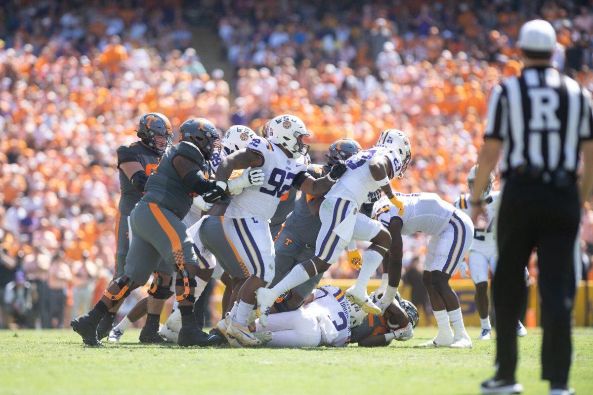 LSU senior safety Greg Brooks Jr. (3) tackles Tennessee sophomore running back Jaylen Wright (20) on Saturday, Oct. 8, 2022, during LSU's defeat to Tennessee 13-40 in Tiger Stadium.