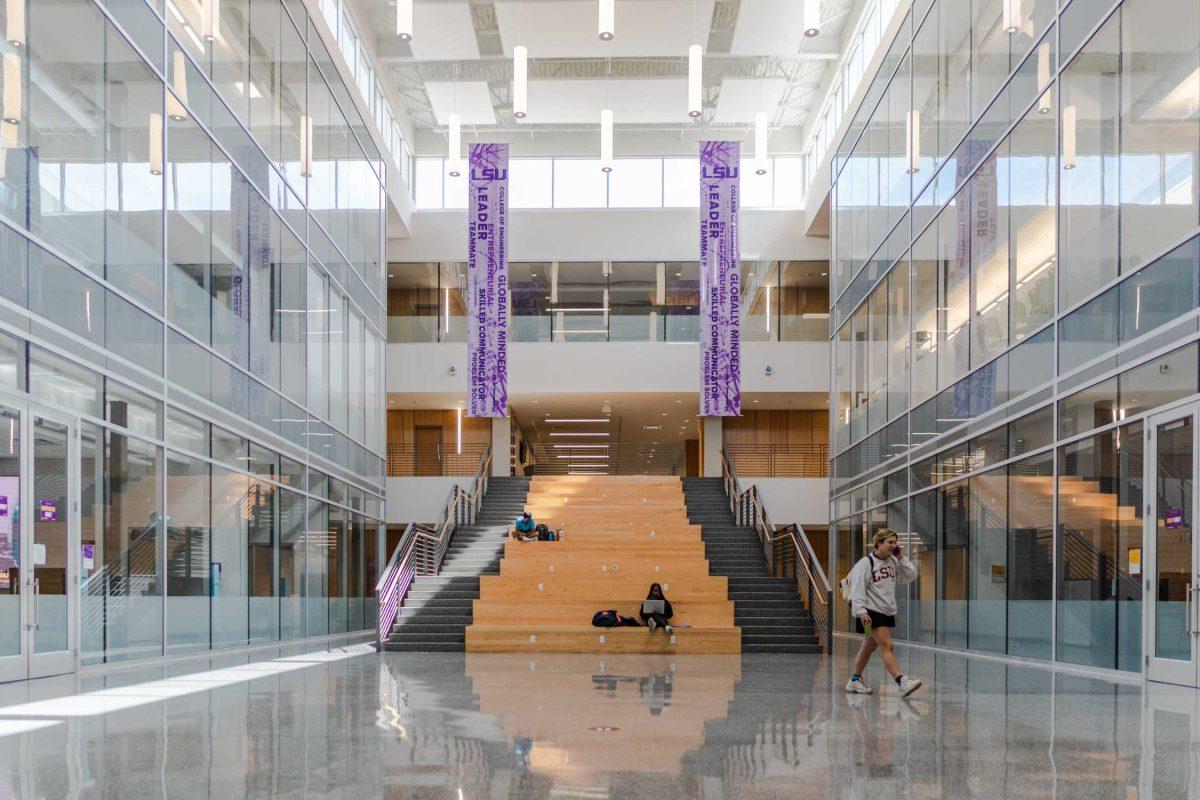 Two students sit on the large steps on Friday, April 29, 2022, in Patrick F. Taylor Hall on South Quad Drive in Baton Rouge, La.