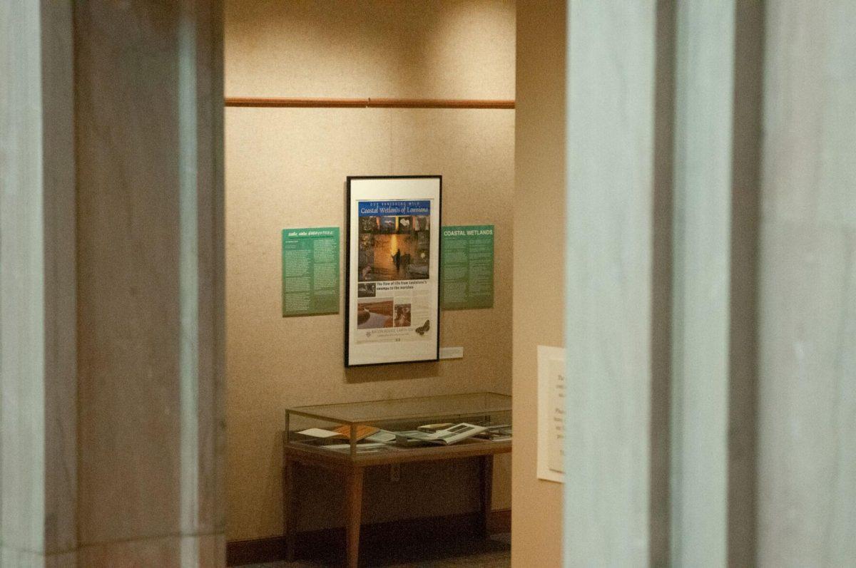 The initial display case for the Water and Louisiana Consequences with Coastal Land exhibit at Hill Memorial Library on Field House Drive in Baton Rouge, La on Tuesday, Oct. 11, 2022 is spotted through a marble doorway.