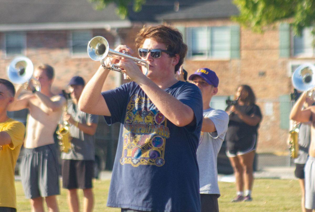 An LSU trumpet player practices on the field on Thursday, Oct. 6, 2022, at the LSU Band Hall on Aster Street in Baton Rouge, La.