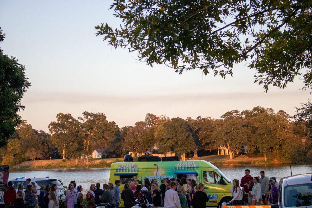 Greek Life block party attendees wait in line for lemonade on Thursday, Oct. 20, 2022, on West Lakeshore Drive on LSU's Campus.