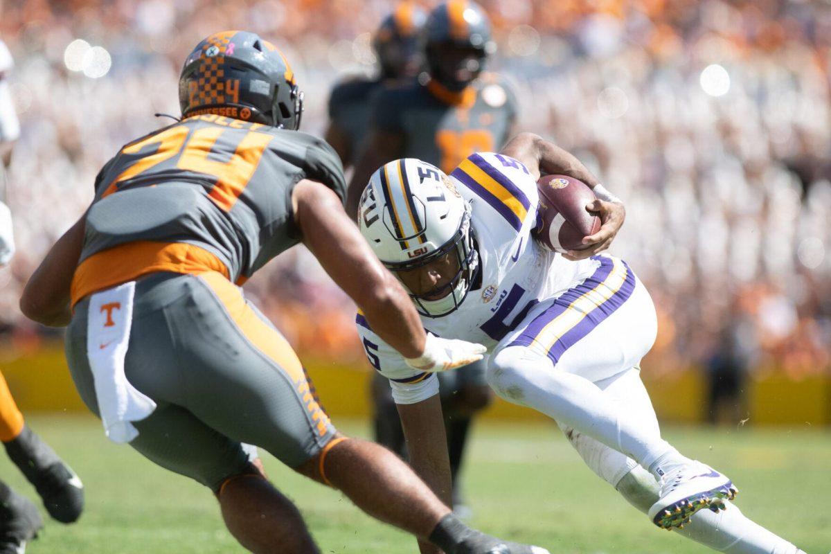 LSU junior quarterback Jayden Daniels (5) attempts to avoid a tackle on Saturday, Oct. 8, 2022, during LSU's defeat to Tennessee 13-40 in Tiger Stadium.