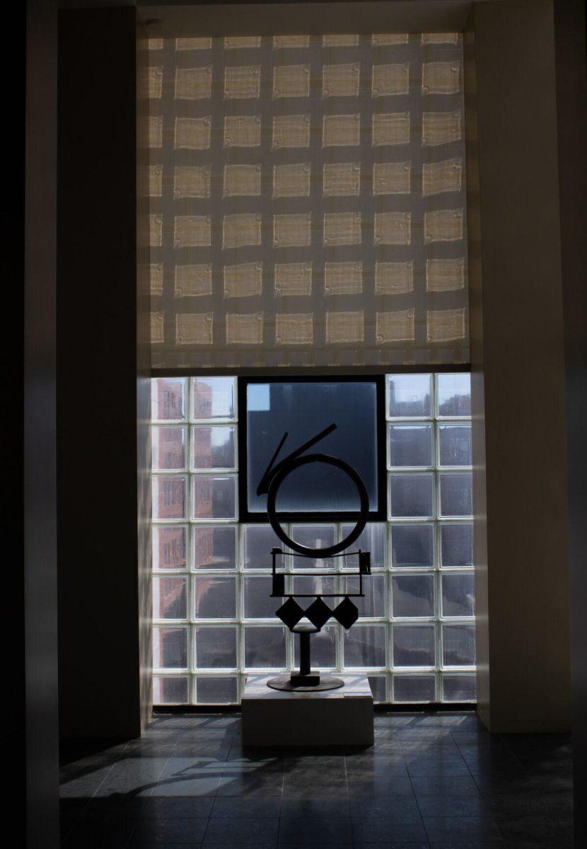 A sculpture sits in front of a window on Saturday, Oct. 1, 2022, at the Ogden Museum of Southern Art in New Orleans, La.