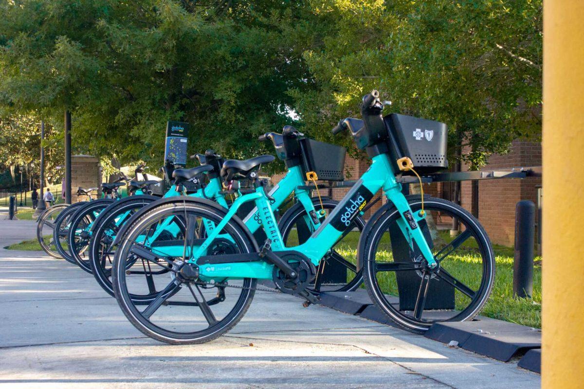 The bright blue electric bikes fill the racks on Monday, Sept. 26, 2022, in front of West Hall in Baton Rouge, La.