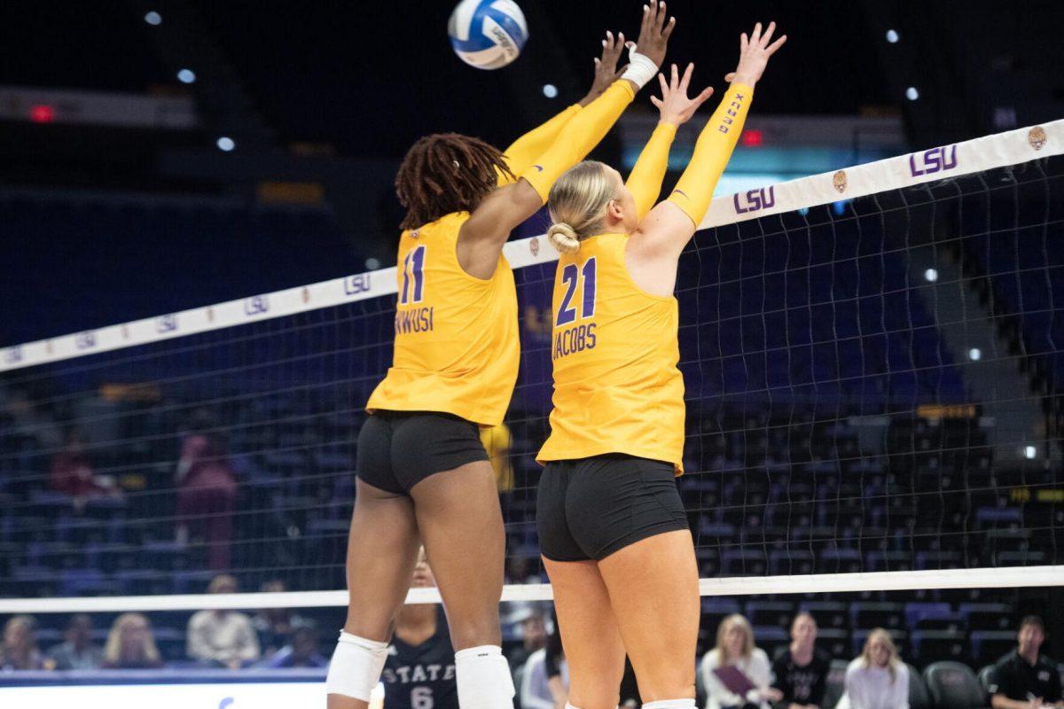 LSU volleyball senior middle blocker Anita Anwusi (11) and graduate student outside hitter Hannah Jacobs (21) block the ball on Sunday, Oct. 30, 2022, during LSU&#8217;s 3-2 loss to Mississippi State at the Pete Maravich Assembly Center in Baton Rouge, La.