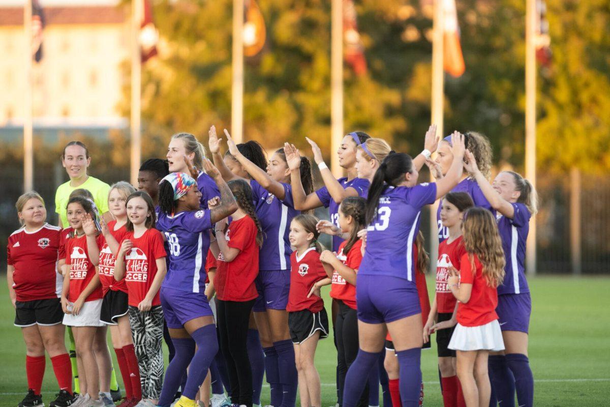 The LSU soccer starting lineup gives high fives on senior night on Thursday, Oct. 27, 2022, before the start of LSU&#8217;s 4-1 victory against Ole Miss at LSU&#8217;s Soccer Stadium off of Nicholson Drive.