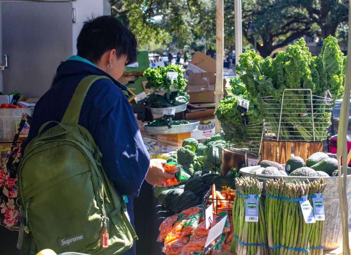 An LSU student browses the vegetable selections on Wednesday, Oct. 5, 2022, on Tower Drive in Baton Rouge, La.