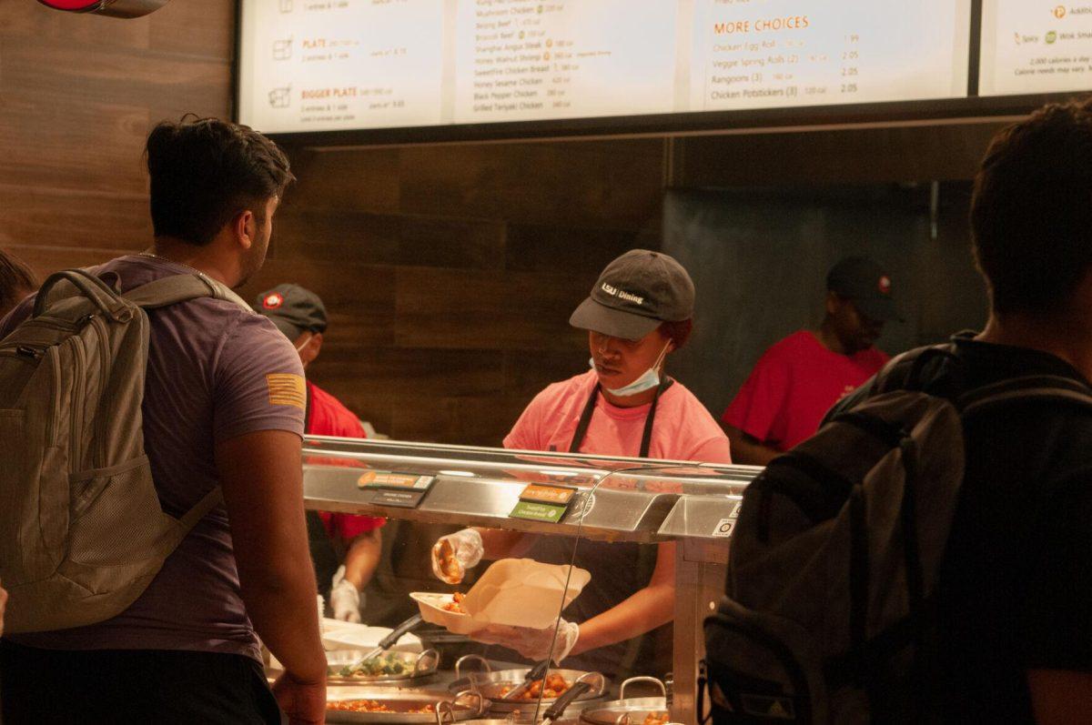 A Panda Express employee fills a to-go box on Thursday, Oct. 6, 2022, in the LSU Student Union on Highland Road in Baton Rouge, La.