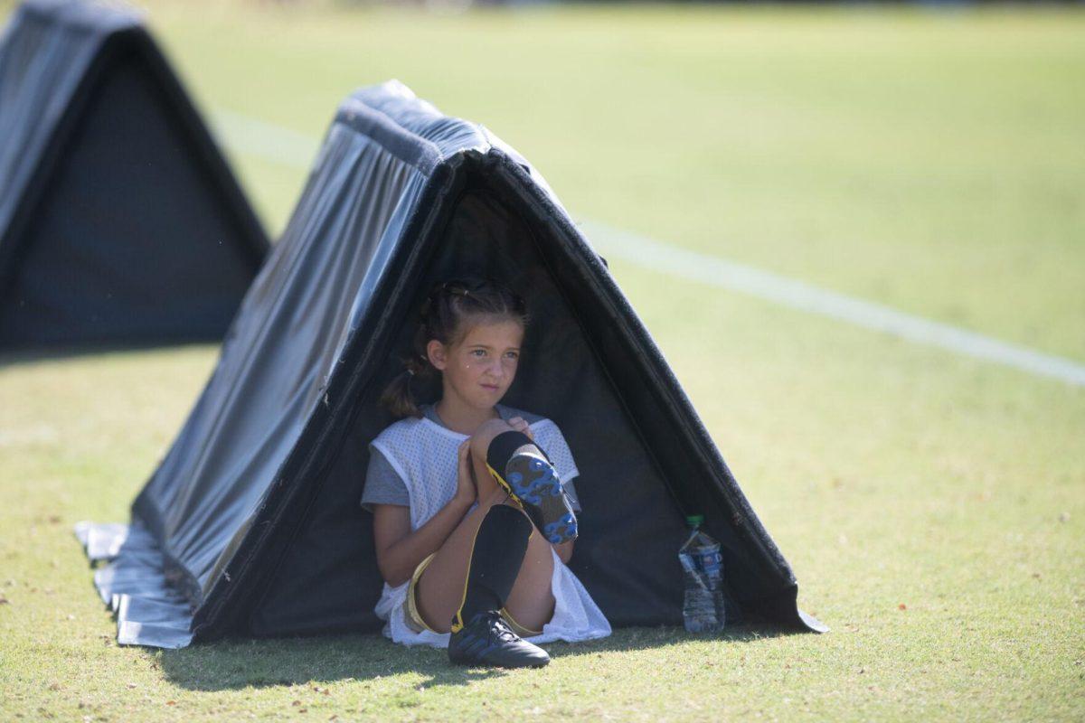 A ball girl rests in the shade on Sunday, Oct. 9, 2022, during LSU&#8217;s defeat to Alabama 0-5 at LSU&#8217;s Soccer Stadium off Nicholson Drive.