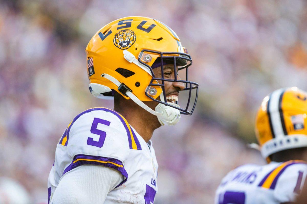 LSU football junior quarterback Jayden Daniels (5) smiles after scoring a touchdown Saturday, Oct. 22, 2022 during LSU&#8217;s 45-20 win against Ole Miss at Tiger Stadium in Baton Rouge, La.