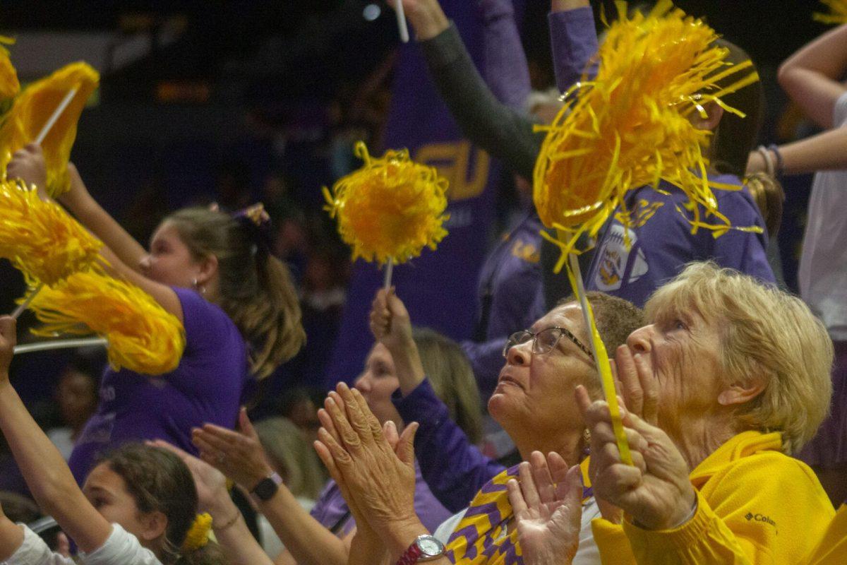 LSU volleyball fans celebrate a point against Ole Miss on Friday, Sept. 30, 2022, during their 3-2 victory against Ole Miss at the Pete Maravich Assembly Center in Baton Rouge, La.