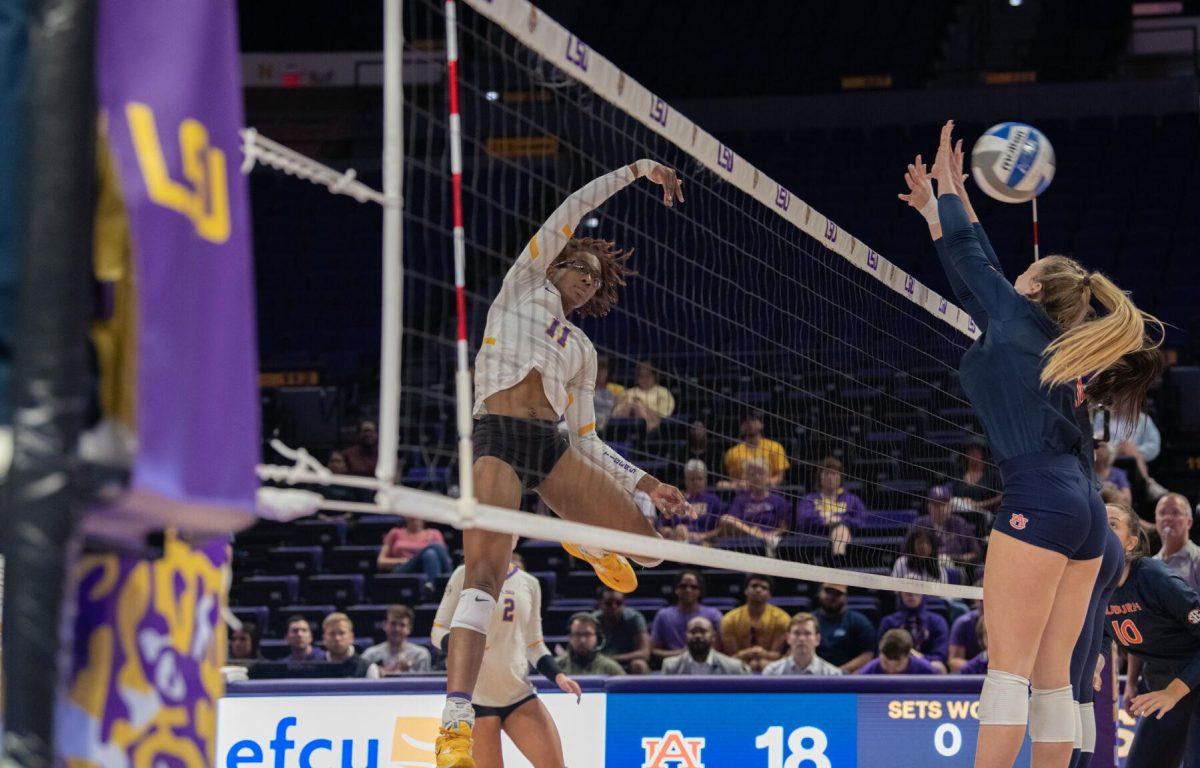 LSU volleyball senior middle blocker Anita Anwusi (11) leaps into the air on Wednesday, Oct. 5, 2022, before their 3-2 victory over Auburn in the Pete Maravich Assembly Center on N. Stadium Drive.