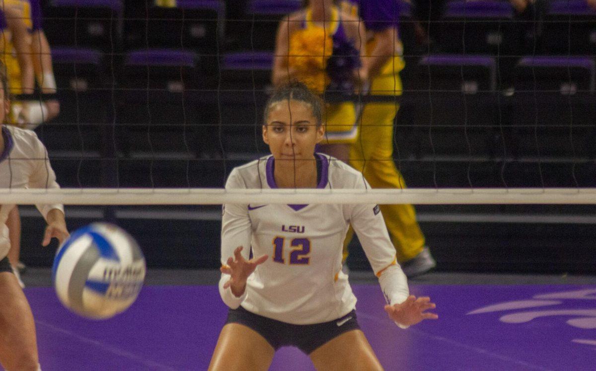 LSU volleyball junior middle blocker Alia WIlliams (12) focuses on the ball on Friday, Sept. 30, 2022, during their 3-2 victory against Ole Miss at the Pete Maravich Assembly Center in Baton Rouge, La.