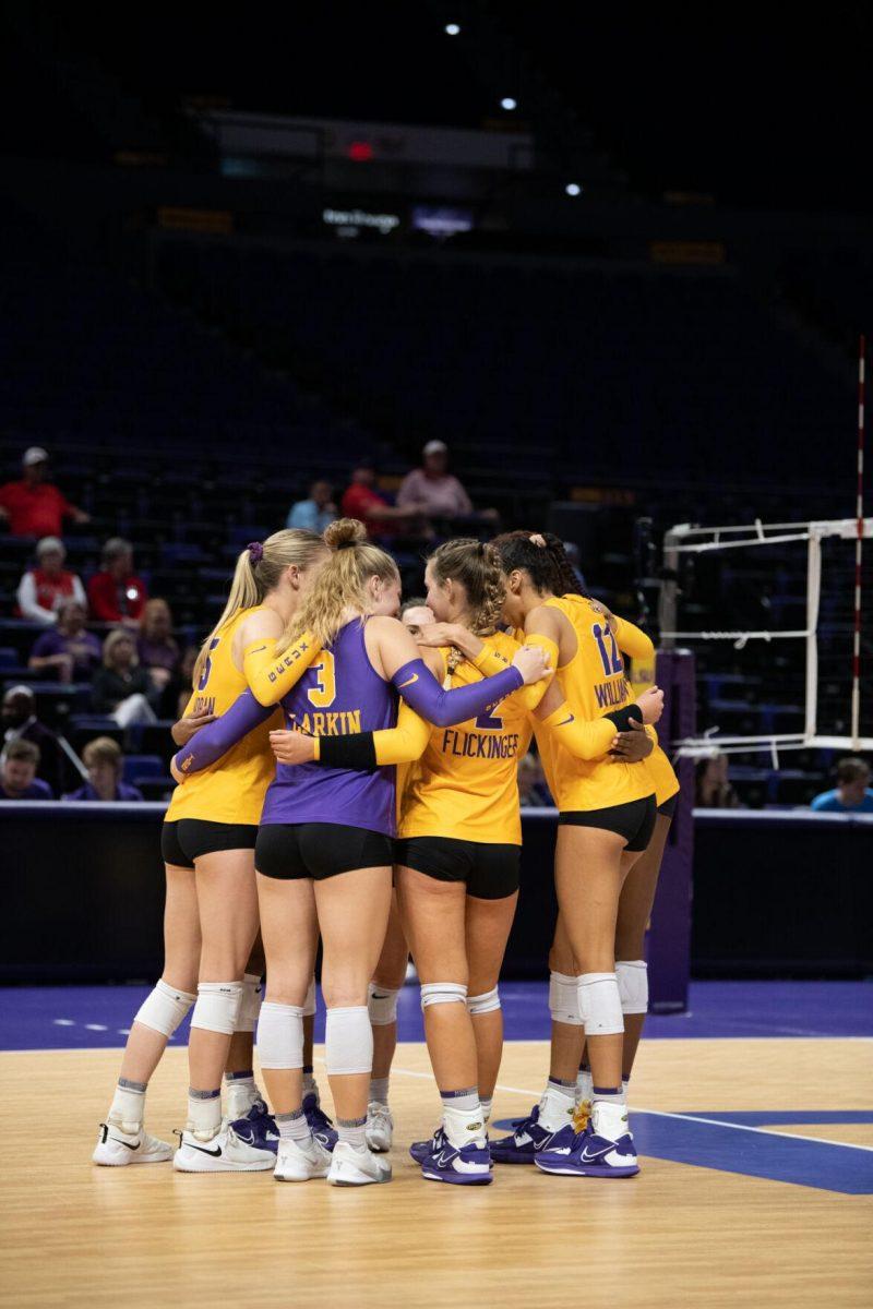 The LSU volleyball team huddles up before the start of the game on Saturday, Oct. 1, 2022, during LSU&#8217;s 2-3 defeat to Ole Miss at the Pete Maravich Assembly Center in Baton Rouge, La.