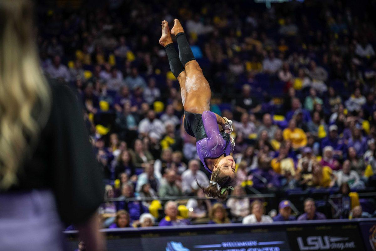 LSU gymanstics all-round freshmen KJ Johnson performs a somersault Friday, March 11, 2022 during LSU's 198.125-197.875 win over University of Utah in the Pete Maravich Assembly Center on N. Stadium Drive in Baton Rouge, La.