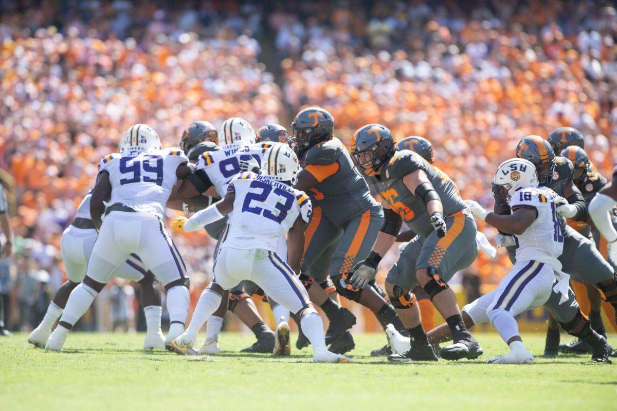 LSU defensive tackles Jaquelin Roy (99), Mekhi Wingo (92), and Micah Baskerville (23) attempt to stop Tennessee on Saturday, Oct. 8, 2022, during LSU's defeat to Tennessee 13-40 in Tiger Stadium.