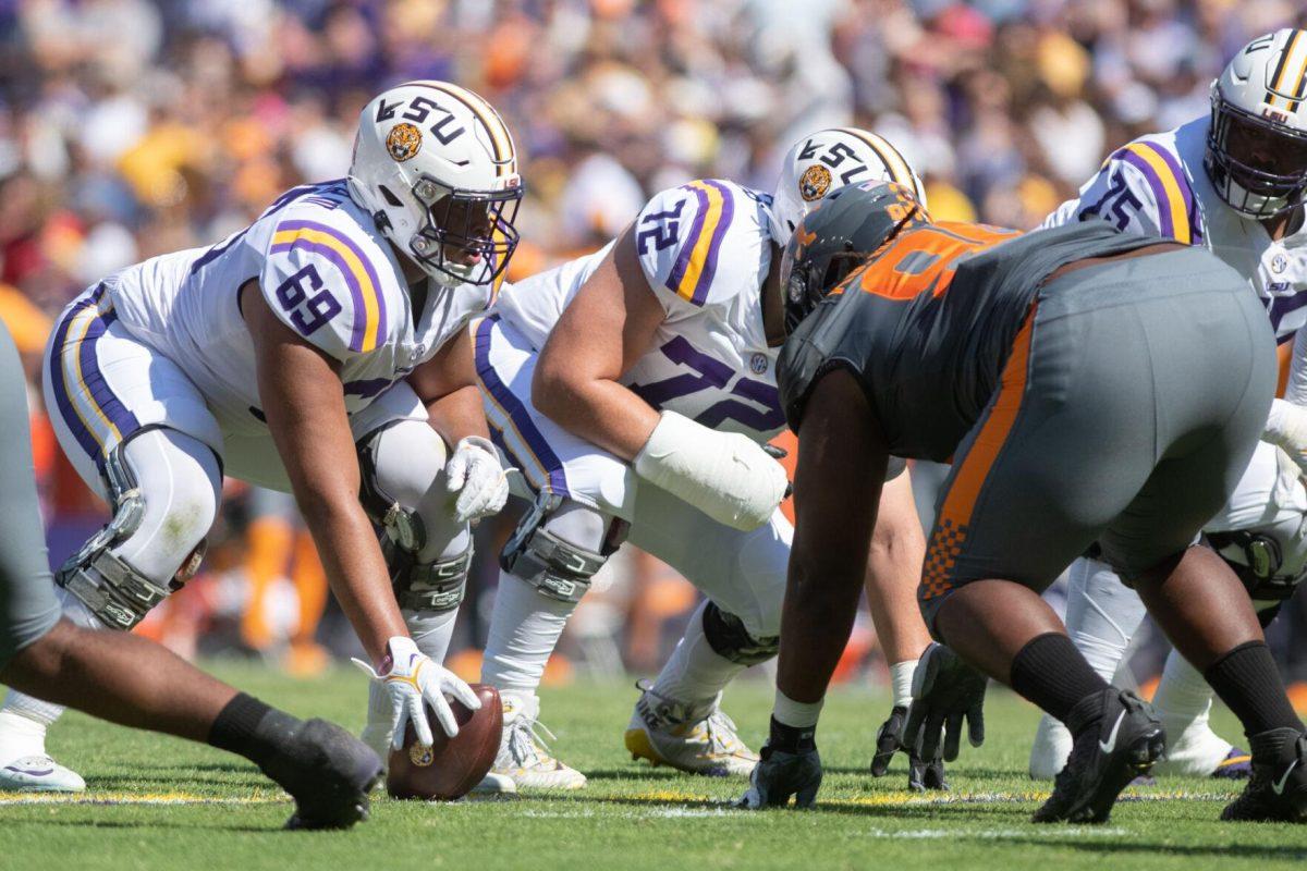 LSU junior center offensive lineman Charles Turner (69) prepares to snap the ball on Saturday, Oct. 8, 2022, during LSU's defeat to Tennessee 13-40 in Tiger Stadium.