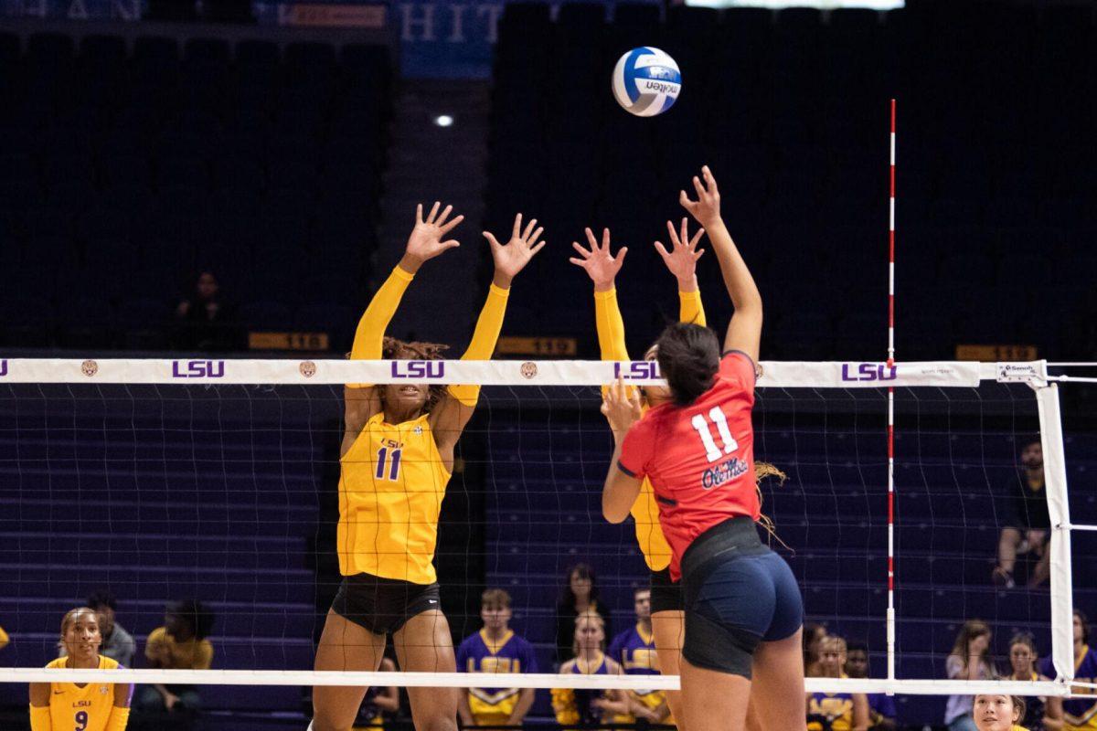 LSU volleyball senior Anita Anwusi (11) and graduate student Hannah Jacobs (21) attempt to block the ball on Saturday, Oct. 1, 2022, during LSU&#8217;s 2-3 defeat to Ole Miss at the Pete Maravich Assembly Center in Baton Rouge, La.