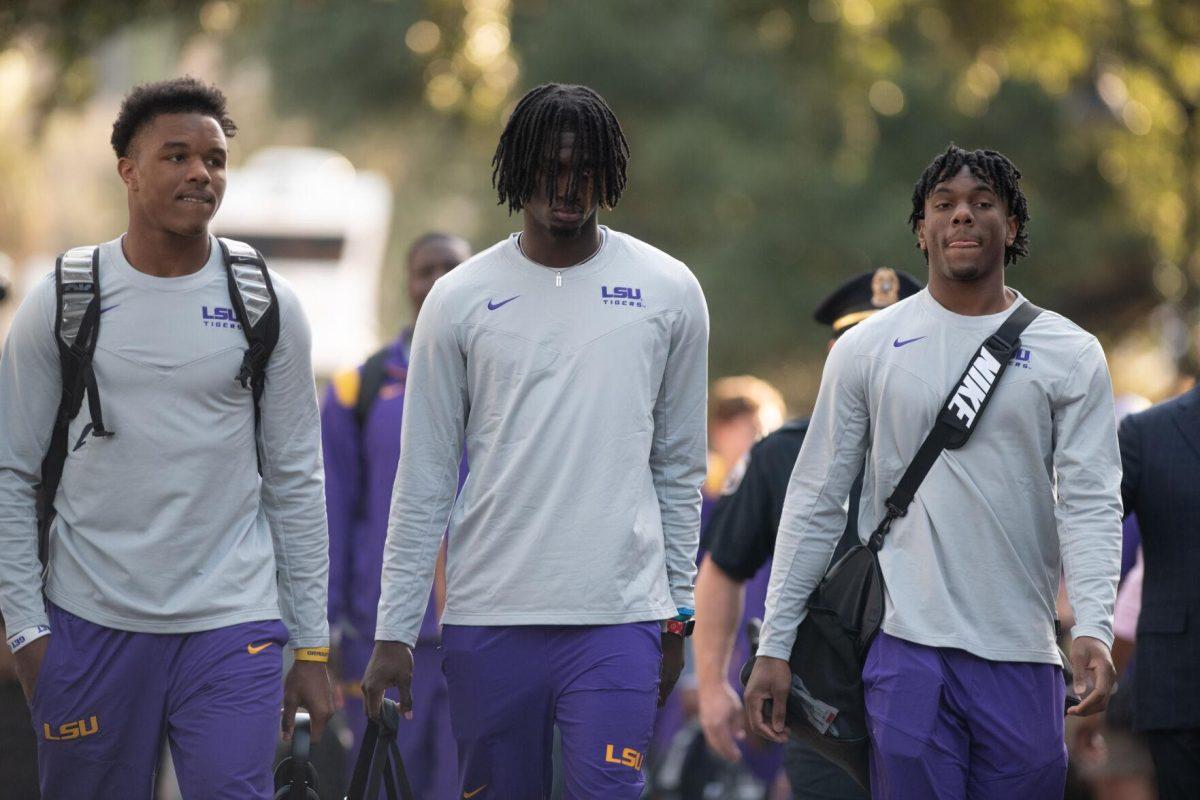 The LSU football team walks down Victory Hill before the start of the game against Tennessee on Saturday, Oct. 8, 2022, on North Stadium Drive.