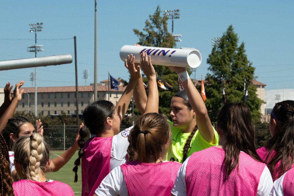 The LSU soccer team carries out a tradition before the start of the game on Sunday, Oct. 2, 2022, during LSU&#8217;s 3-2 win against University of Kentucky at LSU&#8217;s Soccer Stadium off Nicholson Drive.