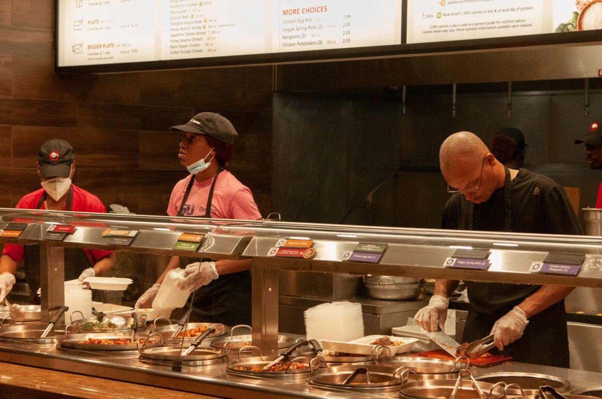 Three Panda Express employees take and assemble orders on Thursday, Oct. 6, 2022, in the LSU Student Union on Highland Road in Baton Rouge, La.