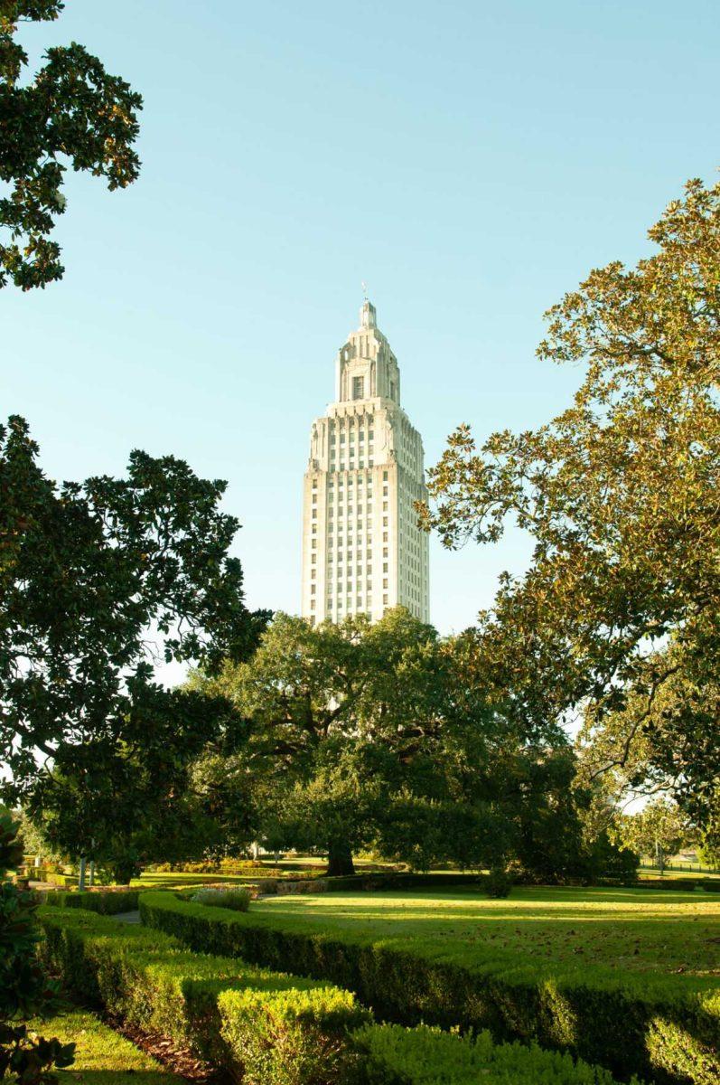 Louisiana's Capitol building peaks through tree branches on Thursday, Oct. 20, 2022, at the Louisiana State Capitol in Baton Rouge, La.