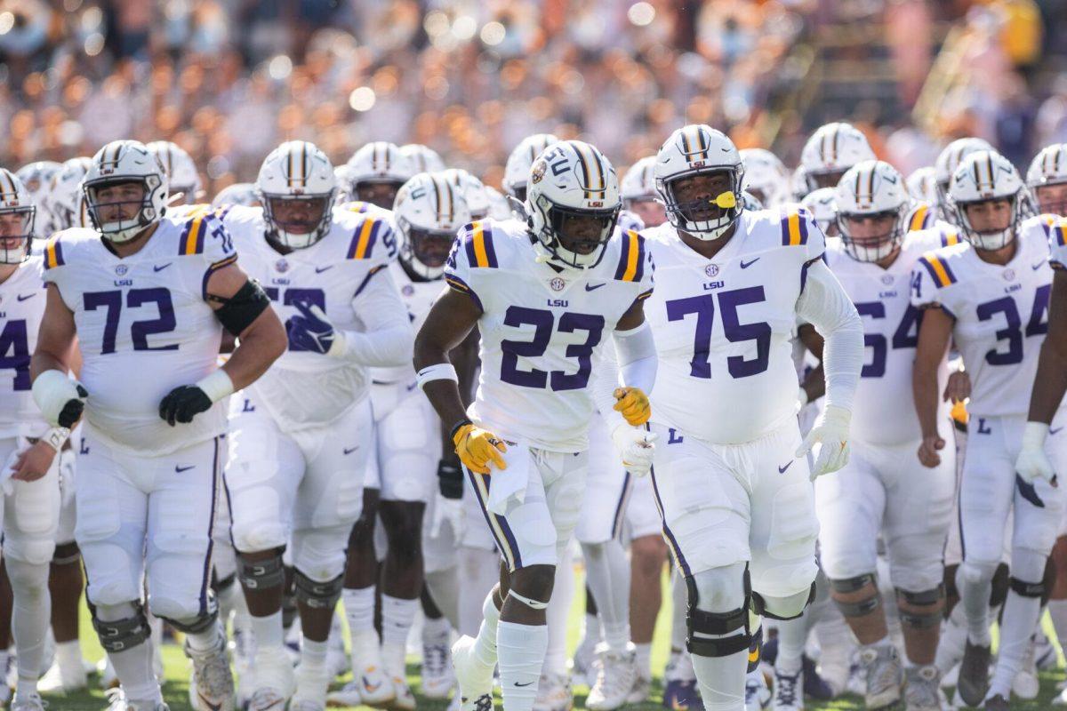 The LSU football team runs on the field before the start of the game against Tennessee on Saturday, Oct. 8, 2022, in Tiger Stadium.