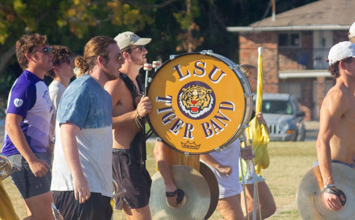 The LSU Tiger Marching Band percussion players run down the practice field on Thursday, Oct. 6, 2022, at the LSU Band Hall on Aster Street in Baton Rouge, La.