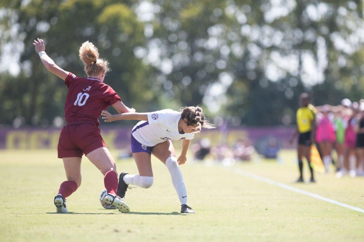 LSU soccer freshman defender Laney Gonzales (12) loses the ball to Alabama forward Riley Mattingly Parker (10) on Sunday, Oct. 9, 2022, during LSU&#8217;s defeat to Alabama 0-5 at LSU&#8217;s Soccer Stadium off Nicholson Drive.