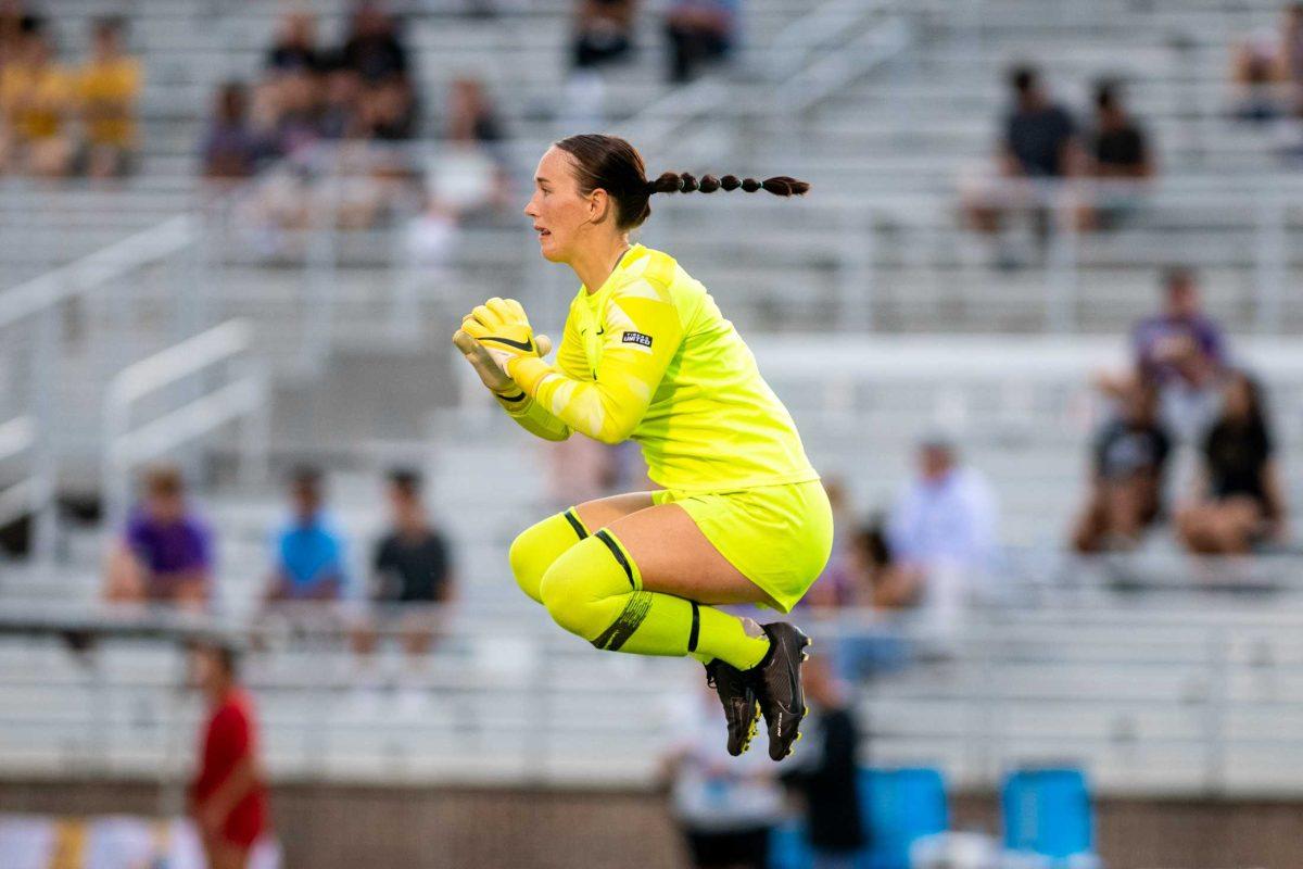 LSU soccer senior goalkeeper Mollee Swift (1) jumps in the air Thursday, Aug. 18, 2022, during LSU&#8217;s 5-0 win against Stephen F. Austin at LSU's Soccer Stadium off of Nicholson Drive.