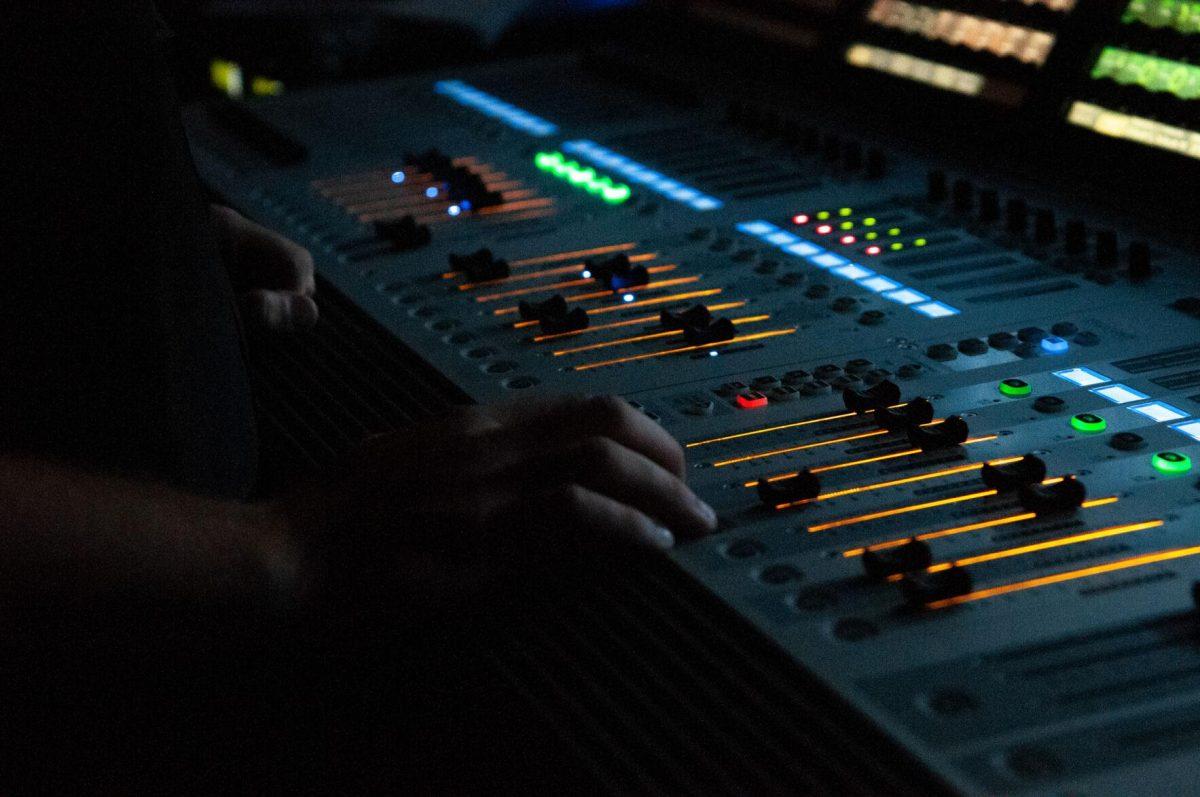 LSU electrical engineering major Arnold Christiansen adjusts sound equipment on Wednesday, Oct. 19, 2022, at LSU's homecoming concert at the PMAC on North Stadium Drive in Baton Rouge, La.