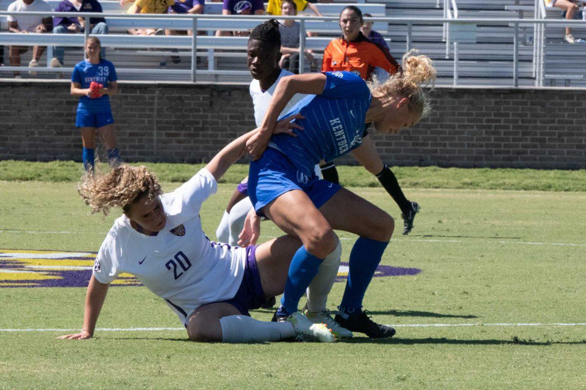 LSU soccer fifth-year senior midfielder Brenna McPartlan (20) falls to the ground while fighting for possession on Sunday, Oct. 2, 2022, during LSU&#8217;s 3-2 win against University of Kentucky at LSU&#8217;s Soccer Stadium off Nicholson Drive.