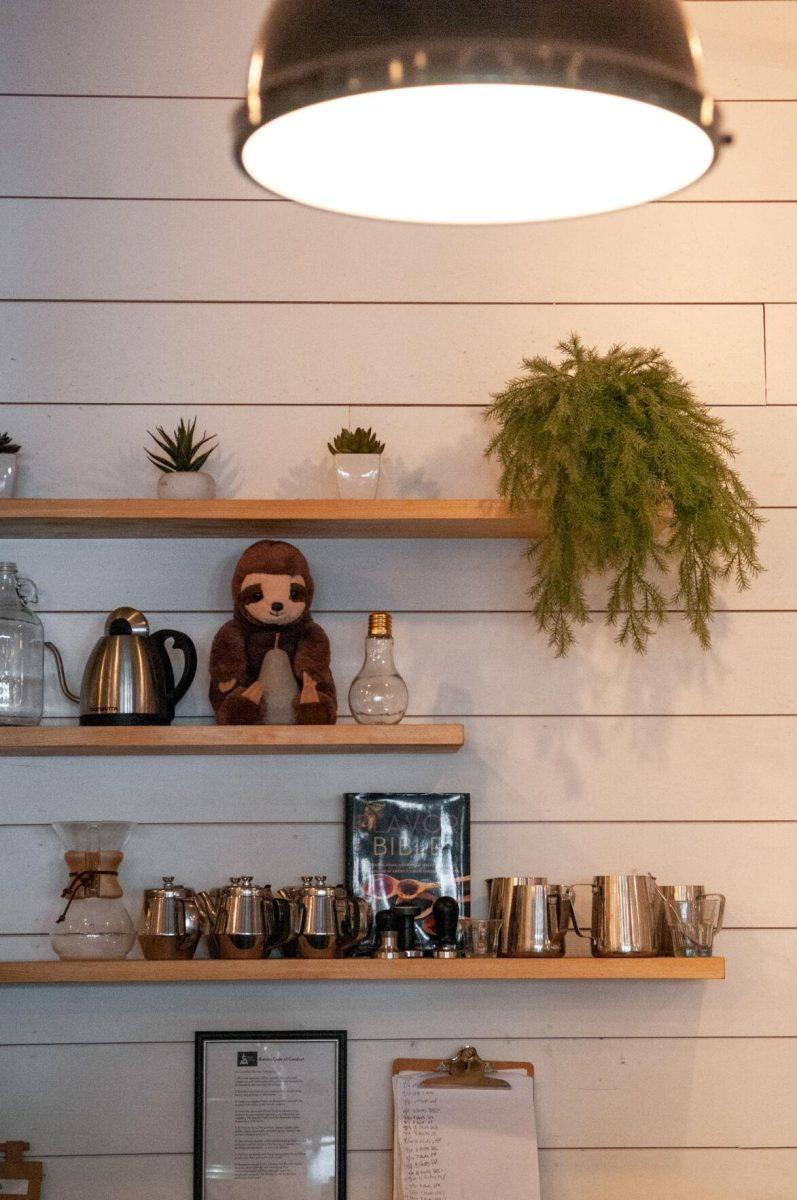 Various decorations including a sloth sit on the shelves on Sunday, Oct. 2, 2022, at Light House Coffee Lee Drive in Baton Rouge, La.