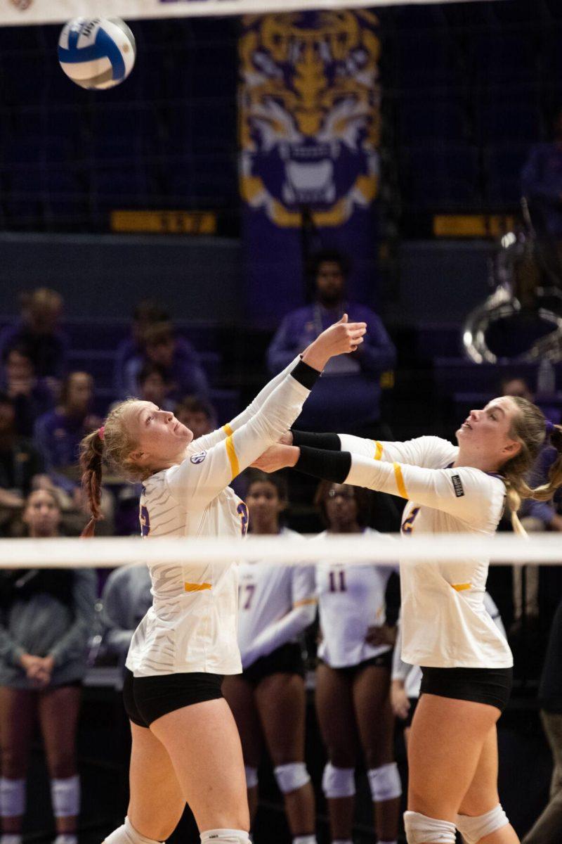 LSU volleyball Maddie Waak (22) and Paige Flickinger (2) attempt to hit the ball on Saturday, Oct. 29, 2022, during LSU&#8217;s 3-2 victory against Mississippi State at the Pete Maravich Assembly Center in Baton Rouge, La.