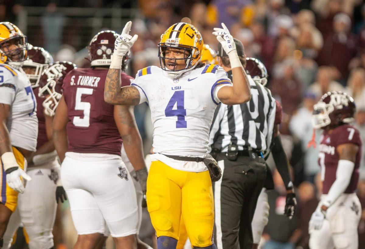 LSU football senior running back John Emery Jr. (4) celebrates a touchdown on Saturday, Nov. 26, 2022, during LSU's 23-38 loss against Texas A&amp;M at Kyle Field.