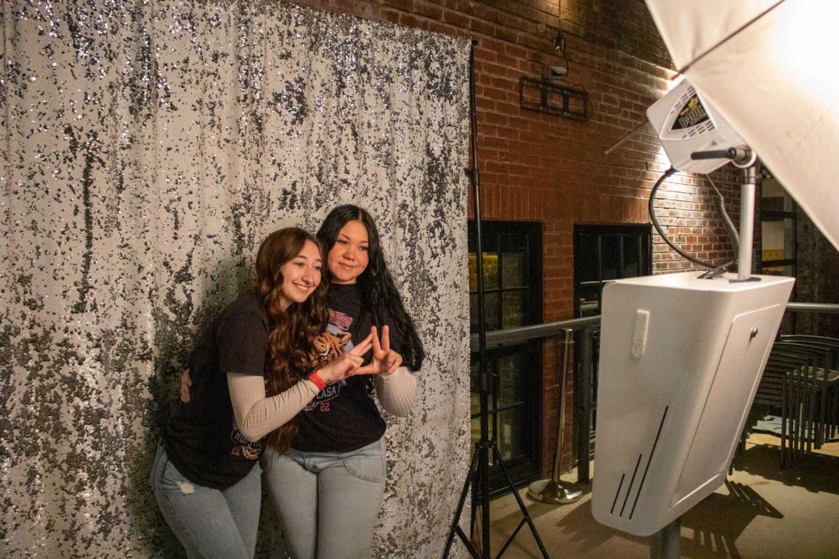 Attendees of Rock the CASA pose at the free photobooth on Friday, Nov. 18, 2022, at Red Stick Social on Government Street in Baton Rouge, La.