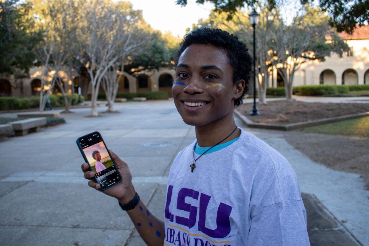 Sophomore student Jahbari Parquet shows off his post on the BLACKLSU26 instagram page on Sunday, Nov. 20, 2022, in the quad on LSU's campus.